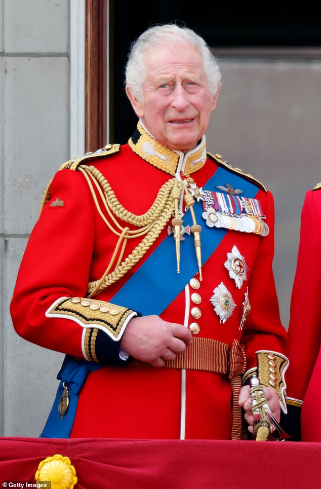 King Charles III (wearing his Welsh Guards uniform) watches an RAF flyover from the balcony of Buckingham Palace during Trooping the Color on June 17, 2023 in London.