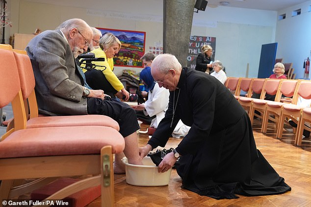 The Archbishop of Canterbury, Justin Welby, performs the Washing of the Feet ceremony during the Sung Eucharist and Holy Thursday Liturgy at St Paul's Church, Maidstone.