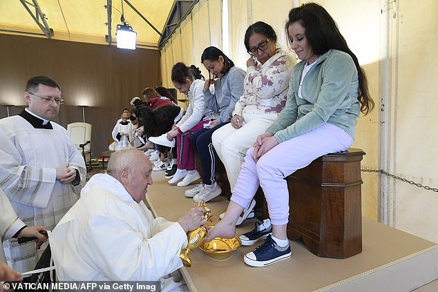 Pope Francis performing the "Foot washing" of inmates during a private visit to the prison