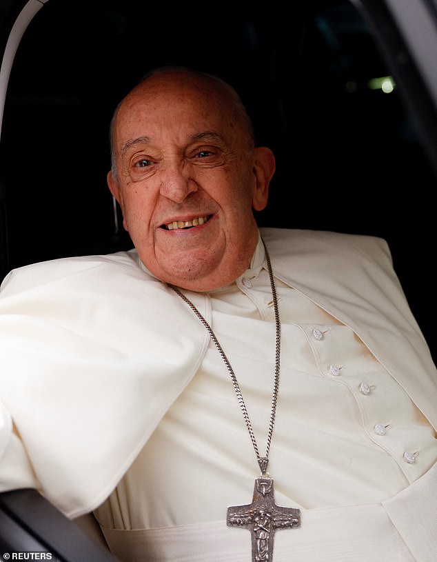 Pope Francis smiles as he leaves after visiting the women's section of the Rebibbia prison