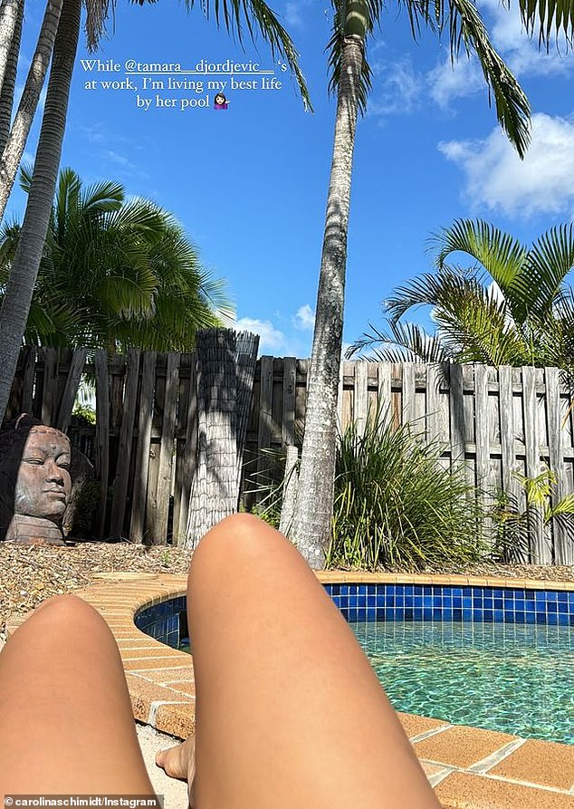 Carolina also shared a photo of her bare legs while sunbathing in her best friend Tamara's backyard and wrote that she was living her 'best life' while Tamara worked.
