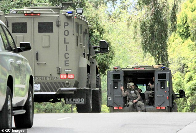 Federal agents in armored vehicles are seen outside Combs' property in Los Angeles.