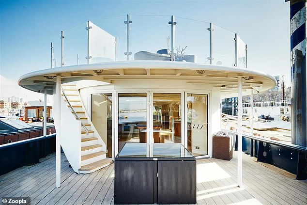 The impressive houseboat has stairs leading to a 17 meter long sundeck on the upper deck