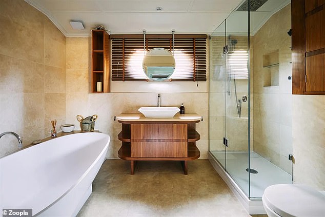The boat also has three bathrooms, including one with both a bath and a separate shower