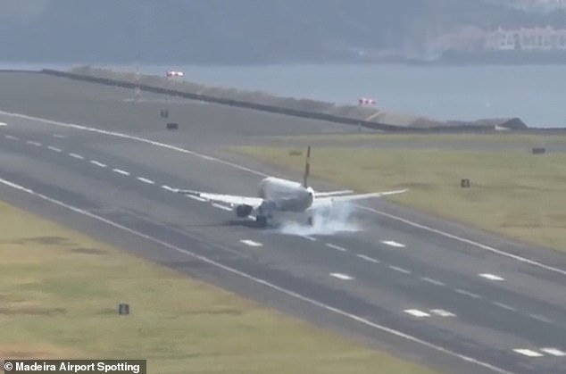 A cloud of smoke appeared around the plane's wheels when it finally made contact with the runway.