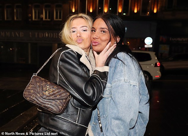 NEWCASTLE: Two friends pose for a photo on the streets last night