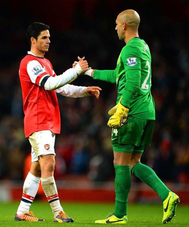 The former teammates shake hands after the clash between Arsenal and Everton in 2013.