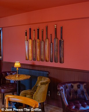 Griffin Inn's cricket-inspired decor includes old bats on the wall