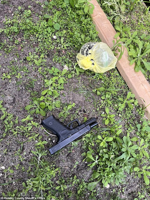 The firearm was found under a shed in Madrid's backyard (pictured), along with a 74-gram bag of marijuana, according to the sheriff.