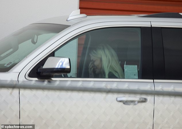 Spelling was seen sobbing behind the wheel of her truck after reuniting with her ex.
