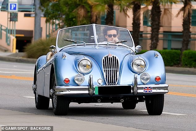 Before the boat trip, Brooklyn was seen cruising the streets in a light blue electric Jaguar XK140.