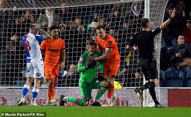 Ipswich goalkeeper Vaclav Hladky is congratulated by his teammates after making a save to preserve his clean sheet.