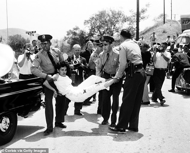 Los Angeles sheriff's deputies photographed forcibly removing Chavez Ravine resident Aurora Vargas from her home in 1959, the same year the stadium was built.