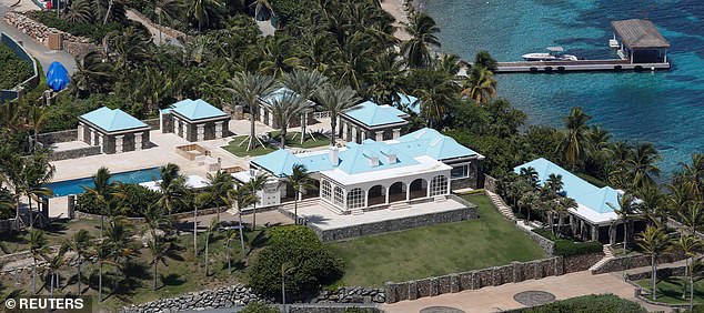 The sprawling property Epstein had built in Little St James, with surrounding lawn and swimming pool. In the background, a pier juts out into the clear blue water.
