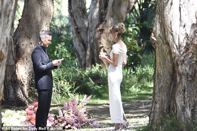 Images and photographs captured by Daily Mail Australia show the Perth bride, 32, heading to a flower sport in Sydney's Centennial Park, where Jono is seen waiting for her.
