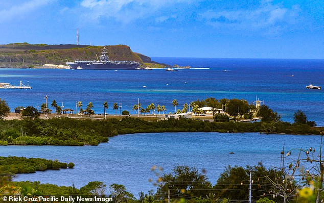 A military ship docks at the Kilo Pier of the Guam Naval Base in Sumay