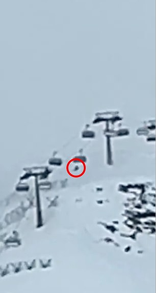 Another angle shows the lone skier on the lift behind the jump to save his life (right, circled)