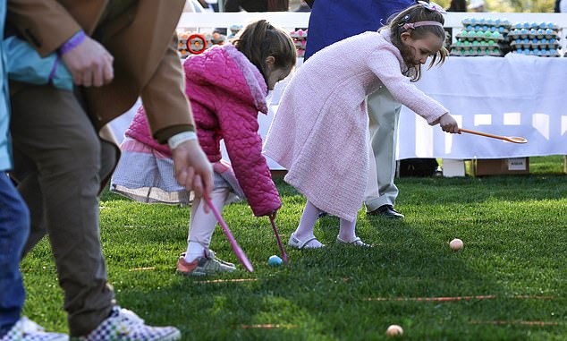 Children participate in the 2023 White House Easter Egg Drop event, which has been held on the South Lawn for nearly 50 years.