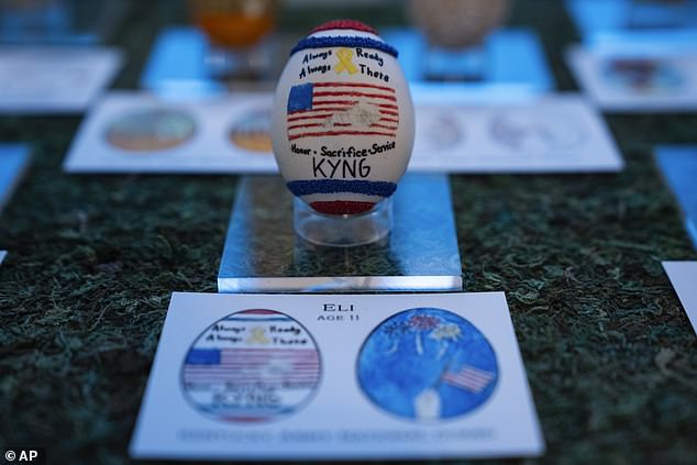 An egg designed by children of members of the military adorns the East Colonnade of the White House before the White House Easter Egg Roll, Thursday, March 28, 2024.