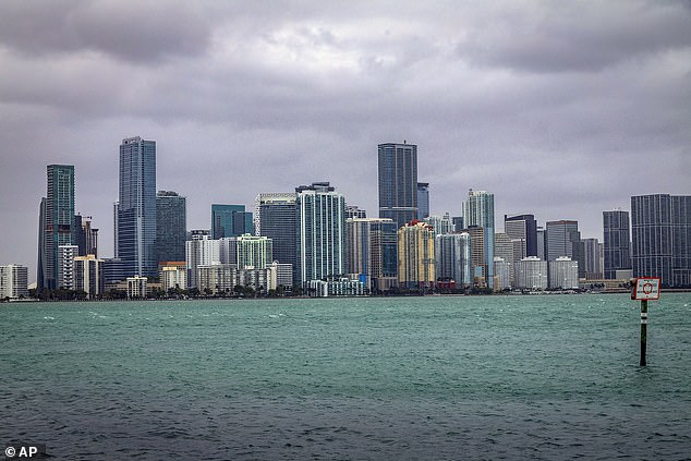 Price said he came up with the idea after experiencing his best off-season trips to destinations prone to unpredictable weather. Pictured: Miami skyline before heavy December rains