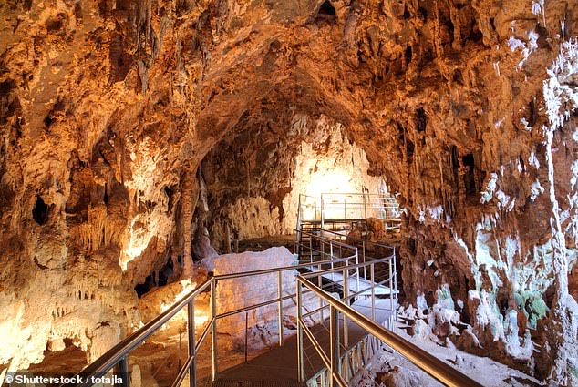 The Jenolan Caves (pictured) are about three hours' drive west of Sydney and Canberra and feature a series of caverns and underground passages thought to extend about 40 kilometers underground.