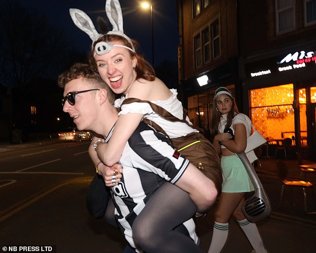 Lazy donkey hitchhiking: revelers in Leeds dressed in football uniforms, dressed as donkeys and dressed as golfers