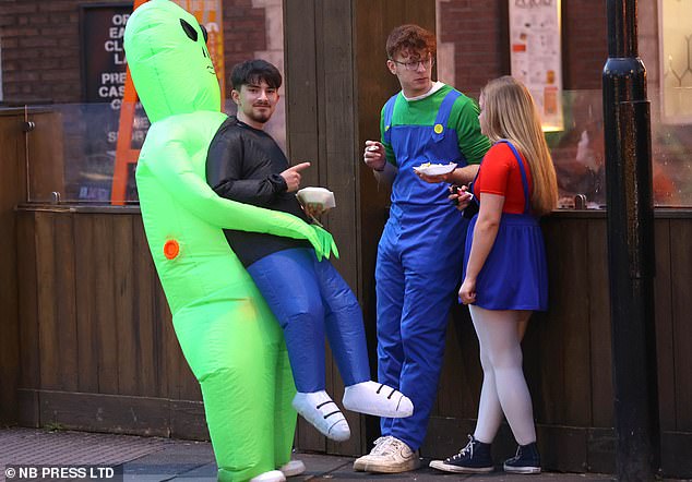 A man is taken away by an alien while he chats with Mario and Luigi, gorging on food before the big night.