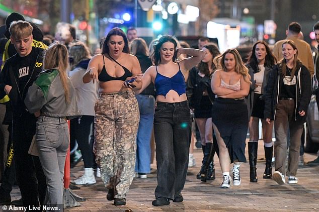 Birmingham partiers took to the streets in tiny crop tops as they looked for a night out
