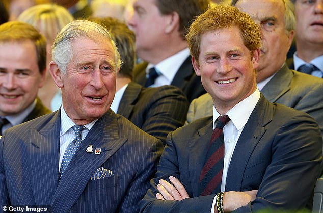 Prince Charles, the Prince of Wales and Prince Harry laugh during the opening ceremony of the Invictus Games on September 10, 2014 in London.