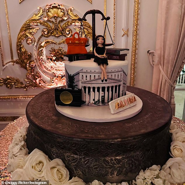 Another showed off the party's wedding cake, this one worthy of a lawyer as it featured a scale, several books and a recognizable courthouse façade, all reinforced by a mini Habba placed on the top layer of the cake.