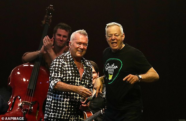 He also performed with guitar virtuoso Tommy Emmanuel (pictured right).