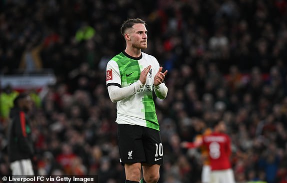 MANCHESTER, ENGLAND - MARCH 17: (SUN SUNDAY) Alexis Mac Allister of Liverpool shows his thanks to the fans at the end of the match at Old Trafford on March 17, 2024 in Manchester, England. (Photo by John Powell/Liverpool FC via Getty Images)