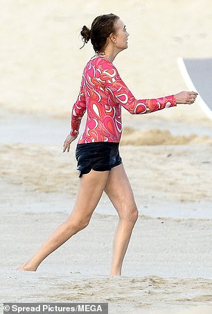 Meanwhile, Nancy sported a pink swirl-print swim top and black shorts as she walked into the water for a dip.