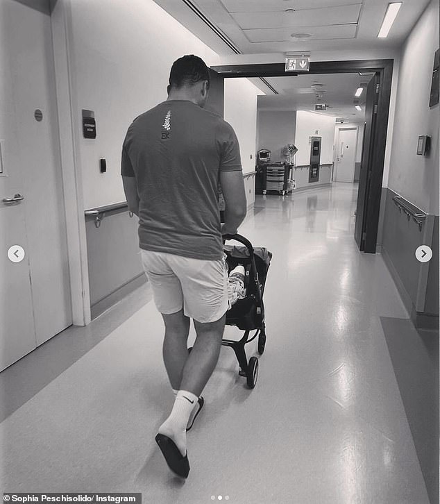 Meanwhile, in another adorable photo, her fiancé Frankie can be seen taking their baby home as she walks through the hospital corridors with her son in a stroller as she leaves the hospital.