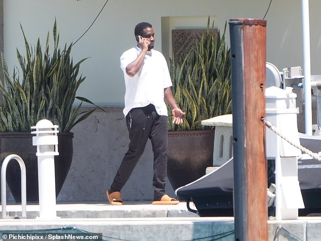The rapper, 54, whose real name is Sean Combs, was seen strolling along the oceanfront pier at his $35 million Miami mansion.
