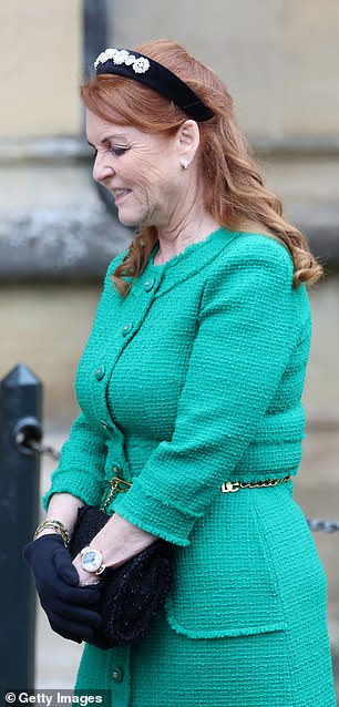 The Duchess of York accessorized the look with a pair of black gloves, a black floral headband, and gold jewelry.