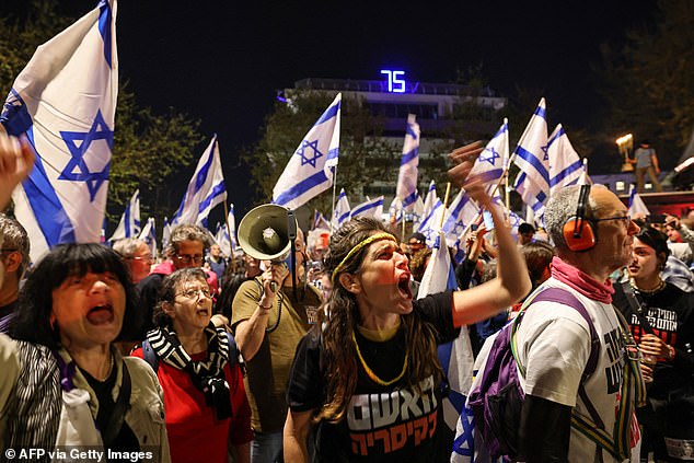 Protesters shout slogans through megaphones at Sunday's protests in Jerusalem