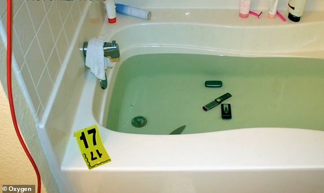 In a strange twist, police also found three mobile phones and a large kitchen knife submerged in the bathtub.