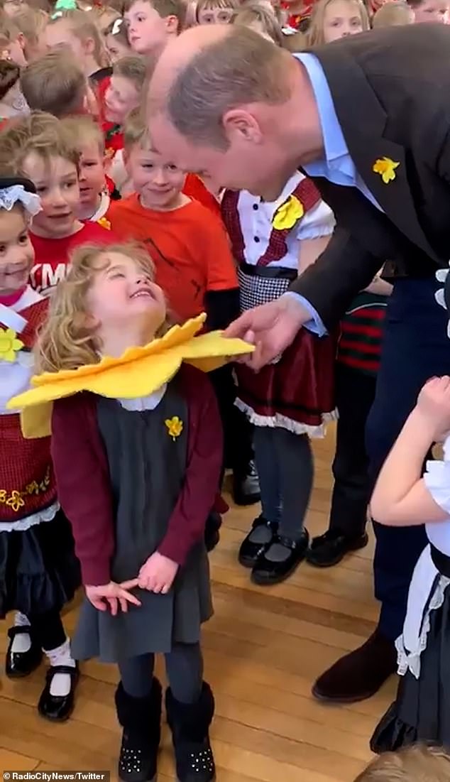 The Prince of Wales praised a little girl's daffodil costume while visiting All Saints Primary School in Wrexham on Friday.