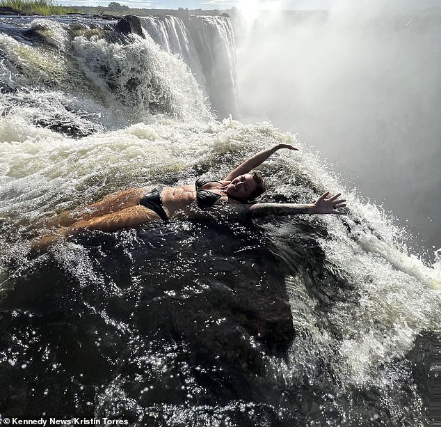 Travel guide Kristin Torres went on a trip to Victoria Falls in Zimbabwe, where she sat on top of the world's tallest waterfall - held back only by her ankles