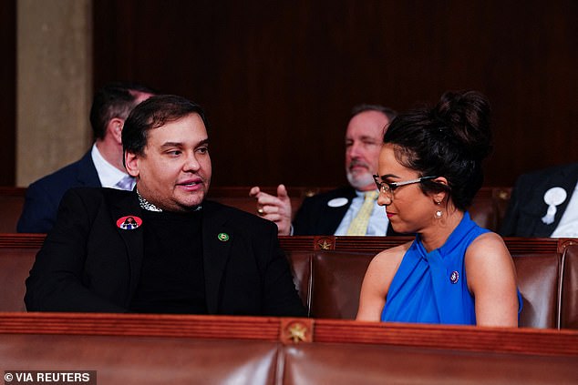Santos quickly took a seat next to Rep. Lauren Boebert.