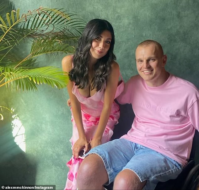 Alex McKinnon has posted a photo of himself and a new mystery woman on social media.