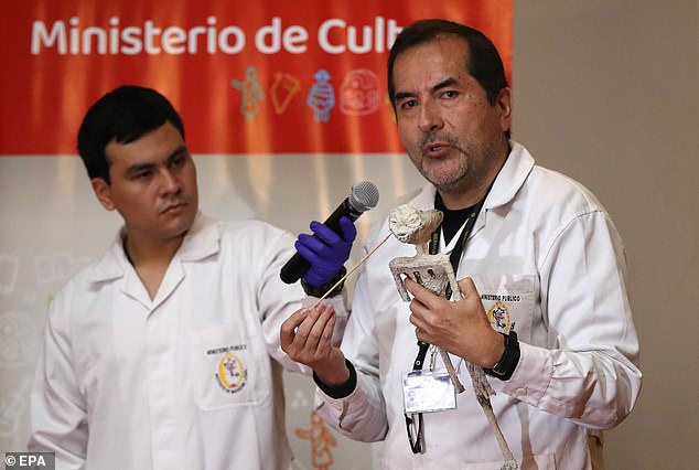 Flavio Estrada (right), forensic archaeologist at the Lima Institute of Legal Medicine and Forensic Sciences of the Public Ministry