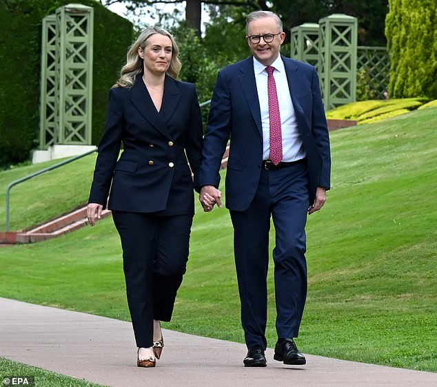 Anthony Albanese (pictured with partner Jodie Haydon) is coming under fire after announcing a $2 billion green energy investment fund for Southeast Asia, while Australia is still in a devastating cost of living crisis .