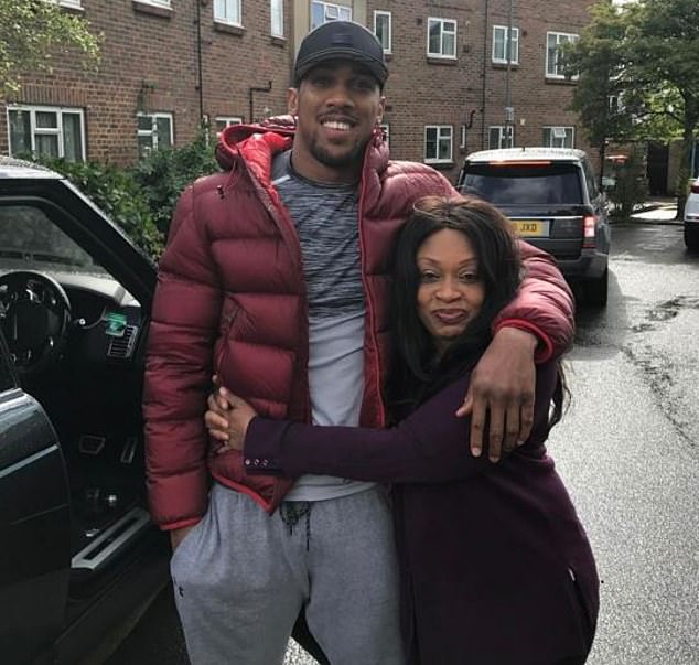 Anthony Joshua and his beloved mother Yeta, who he says he still lives with in their London home.