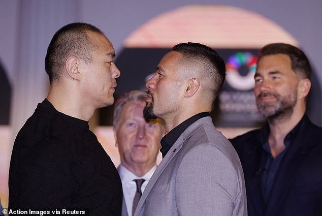 Billboard Zhilei Zhang (left) weighed more than three kilos more than Joseph Parker (right)