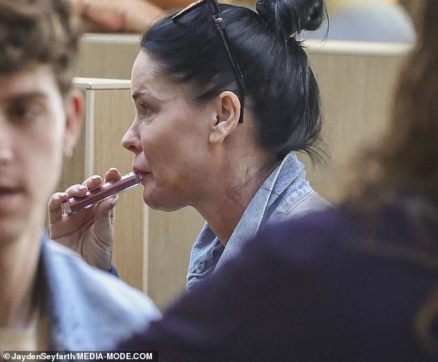 The lead singer of 90s pop group Aqua, Lene Nystrøm, was seen smoking a vape in the Sydney Airport food court on Wednesday following her strange behavior on stage at the band's concert in Perth last week.