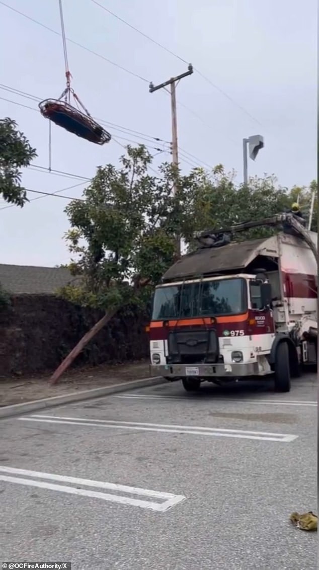 Video has revealed the moment a California woman was airlifted to the hospital after being crushed inside a garbage truck when the dumpster she was sleeping in was emptied.