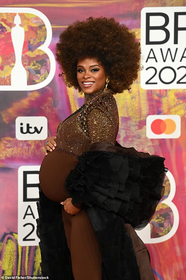 Heavily pregnant Fleur East, 36, stunned in brown and sporting a huge afro at the BRIT Awards 2024 in London on Saturday.