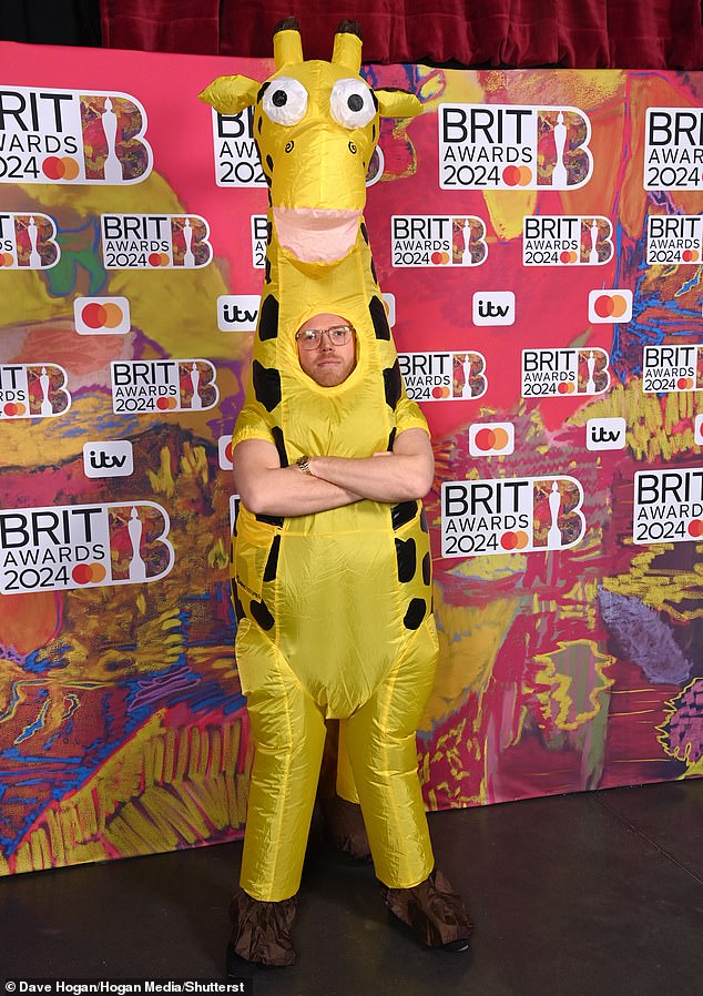 This TV favorite decides to ditch the traditional suit and arrive on the BRIT Awards 2024 red carpet dressed as a giraffe at London's O2 on Saturday night.